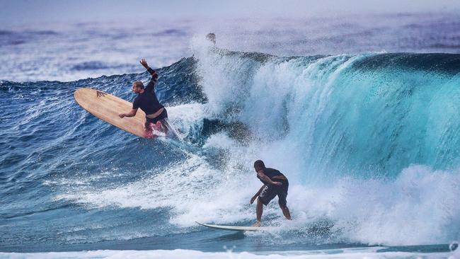 An experienced longboarder carving it up at Snapper Rocks. Picture: NIGEL HALLETT