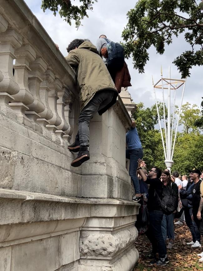 The crowd heading toward the palace could not see they were going to be stuck behind a wall until it was too late because there was so many people. Picture: Chantelle Francis