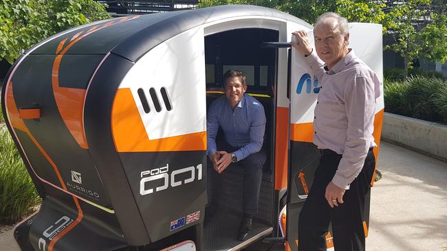 Tonsley precinct director Philipp Dautel and Aurrigo's Autonomous Programs Director — Australia &amp; Asia Pacific Roger van der Lee with the Aurrigo pods that will be used within the MAB area at Tonsley.