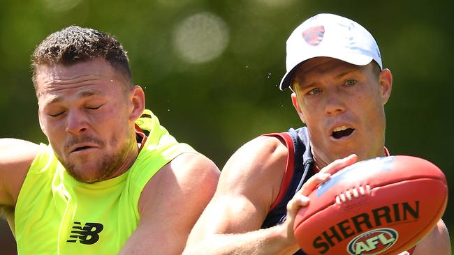 MELBOURNE, AUSTRALIA - NOVEMBER 18: Jake Melksham of the Demons marks infront of Steven May of the Demons during a Melbourne Demons Training Session & Media Opportunity at Gosch's Paddock on November 18, 2019 in Melbourne, Australia. (Photo by Quinn Rooney/Getty Images via AFL Photos)