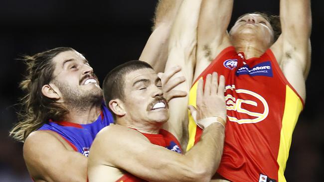 MELBOURNE, AUSTRALIA - APRIL 17: Wil Powell of the Suns marks the ball during the round five AFL match between the Western Bulldogs and the Gold Coast Titans at Marvel Stadium on April 17, 2021 in Melbourne, Australia. (Photo by Daniel Pockett/Getty Images)