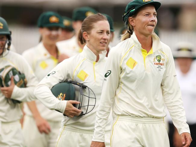 CANBERRA, AUSTRALIA - JANUARY 30: Meg Lanning of Australia leads her team off the field after the match finished in a draw during day four of the Women's Test match in the Ashes series between Australia and England at Manuka Oval on January 30, 2022 in Canberra, Australia. (Photo by Mark Kolbe/Getty Images)