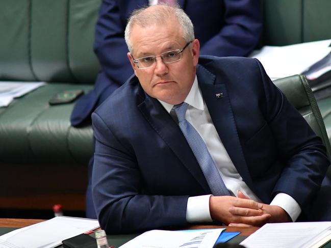 CANBERRA, AUSTRALIA - MAY 14: Prime Minister Scott Morrison during Question Time in the House of Representatives at Parliament House on May 14, 2020 in Canberra, Australia. Today is final day of a special parliamentary sitting, after parliament was adjourned due to the COVID-19 outbreak. Parliament is set to resume in August 2020.  (Photo by Sam Mooy/Getty Images)