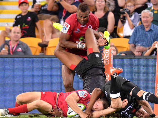 BRISBANE, AUSTRALIA - FEBRUARY 24: Reds player James Tuttle scores the match winning try during the round one Super Rugby match between the Reds and the Sharks at Suncorp Stadium on February 24, 2017 in Brisbane, Australia. (Photo by Bradley Kanaris/Getty Images)