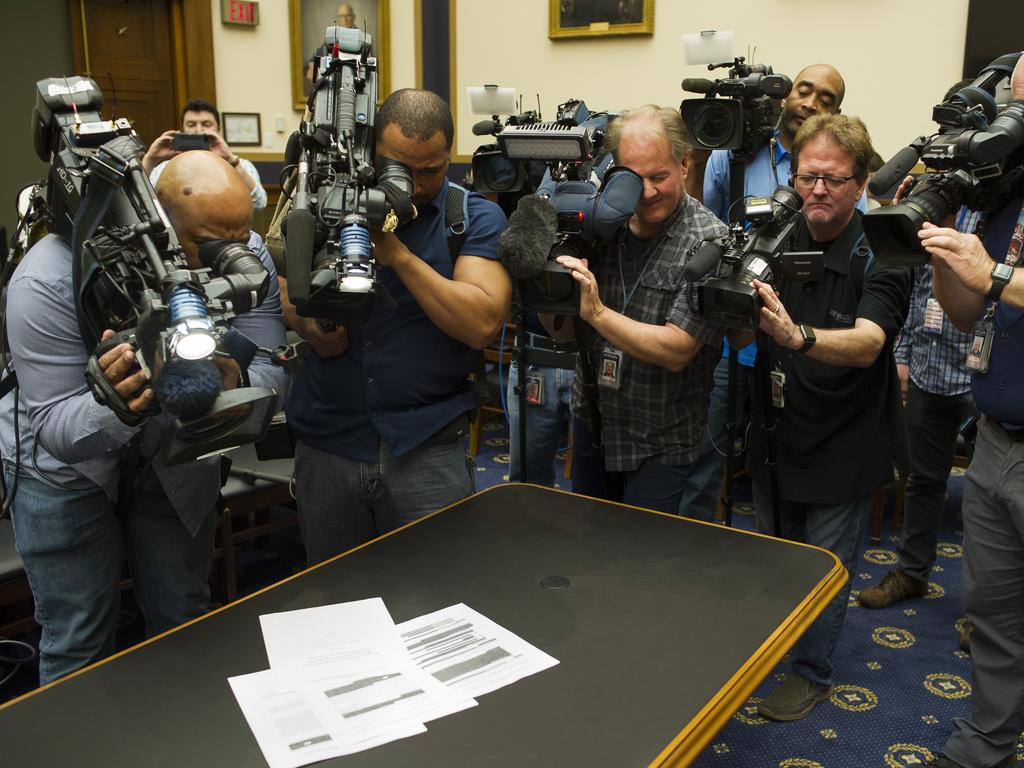Photojournalists photograph four pages of the Mueller Report laid on the witness table in the House Intelligence Committee hearing room on Capitol Hill, in Washington DC. Picture: AP