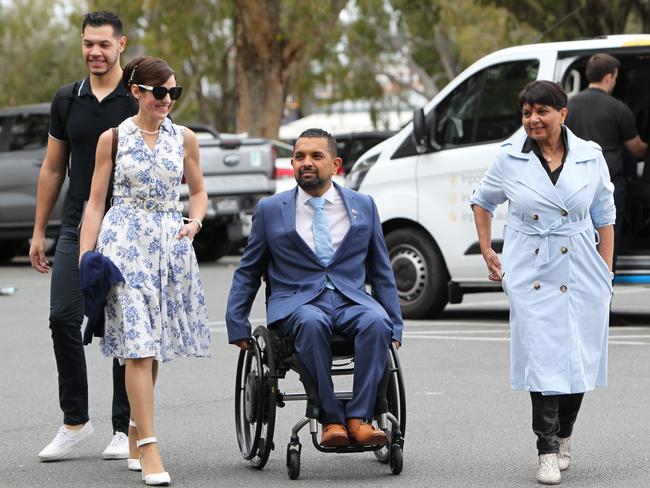 Dr Dinesh Palipana arrives at the Liberal Party pre-selection meeting with supporters including his mother Chithrani. Picture: Mike Batterham.