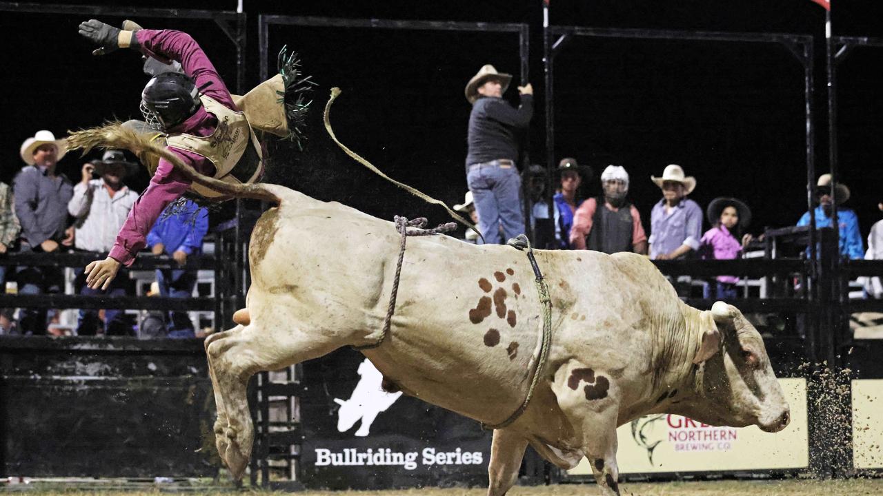 Jake Simpson gets bucked from his ride in the Great Northern Bull riding series bull ride event at the Mossman Showgrounds. Picture: Stephen Harman