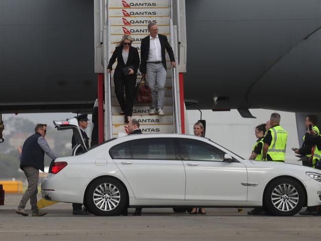 Anthony Albanese and his partner Jodie Haydon arrive back in Sydney. Picture: John Grainger.