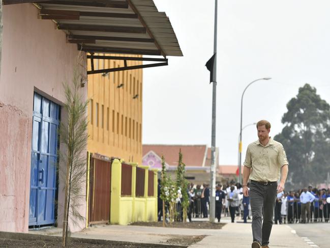 Prince Harry walks on Princess Diana Street in Huambo, Angola. Picture: AP