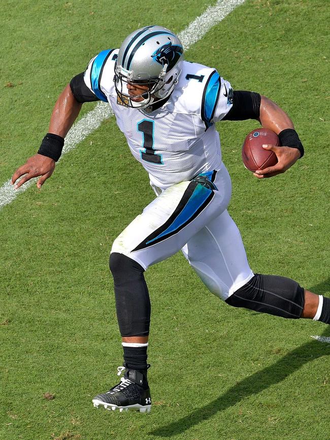 Cam Newton avoids a tackle. Picture: Getty