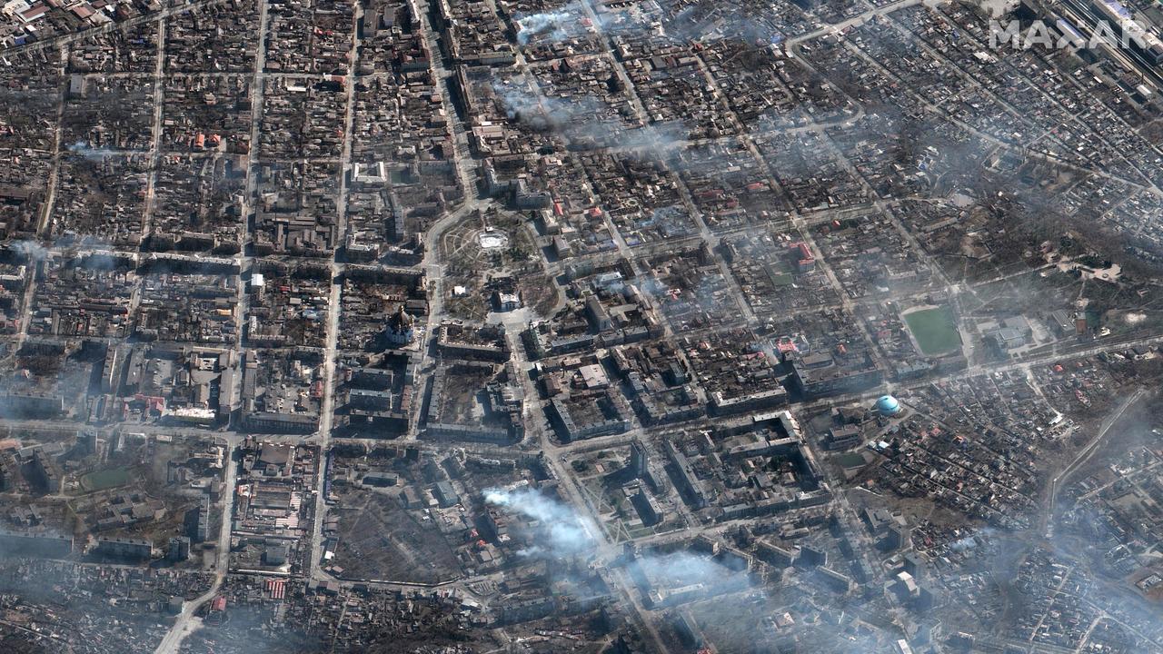 An overview of burning buildings and the Mariupol theatre. Picture: Maxar Technologies/AFP