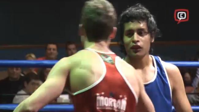 26-year-old Nowroz Amin (blue singlet) during an amatuer boxing match in 2011.