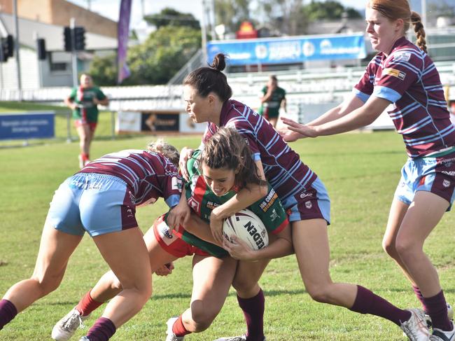 The Capras muscle up in defence against Wynnum Manly Seagulls.
