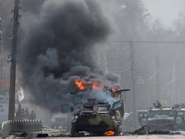 A Russian Armoured personnel carrier burning during fighting with the Ukrainian armed forces in Kharkiv. Picture: AFP