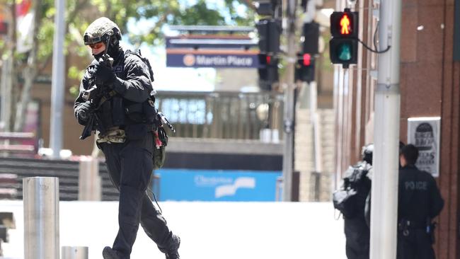 Heavily armed police take up positions during the siege. Picture: Adam Taylor