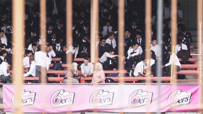 Students at North Sydney Boys School were evacuated to North Sydney oval after the bomb threat. Picture John Grainger