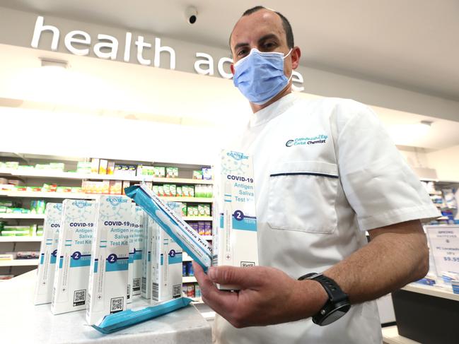 Community Care Chemists CEO Nick Salkeld with the test kits. Picture: Mike Dugdale