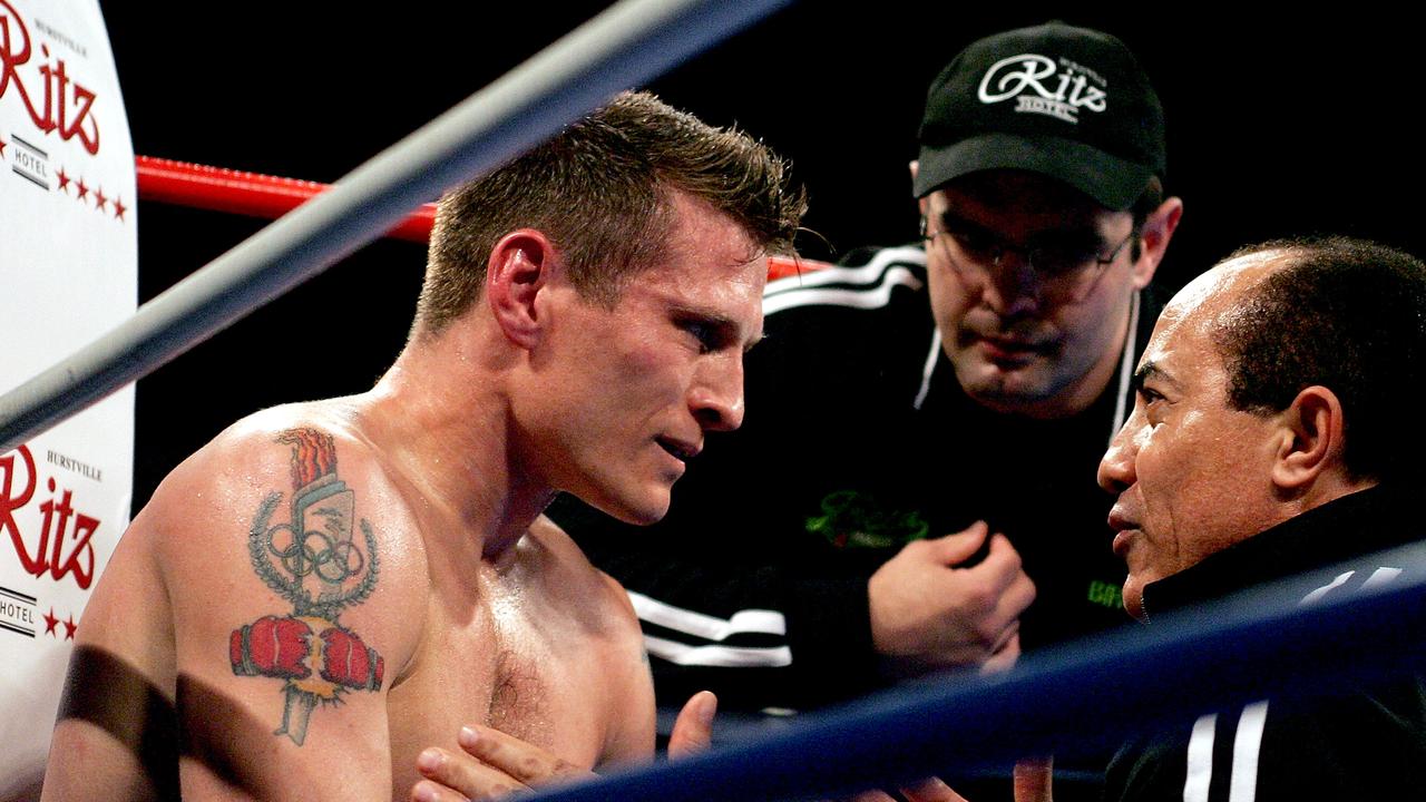 Danny Green receives instructions from Ismael Salas (right) in his fight against James Crawford back in 2005. Picture: Getty