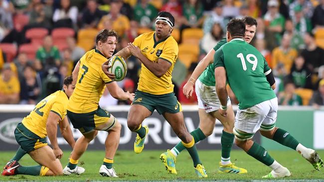 Kurtley Beale (centre) of the Wallabies in action during the First Test between Australia and Ireland in Brisbane.