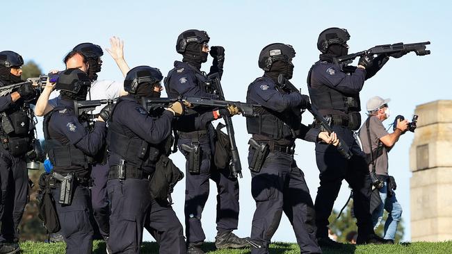 Heavily armed police fire rubber bullets at protesters. Picture: NCA NewsWire / Ian Currie