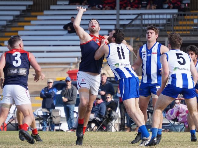 Mildura's Anthony Matthews contests a ball up inside forward 50 against Ouyen United in the Sunraysia league. Picture: Michael DiFabrizio