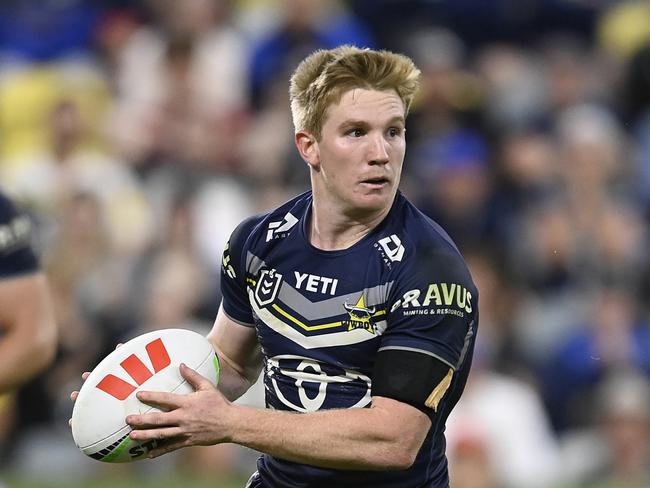 TOWNSVILLE, AUSTRALIA - JULY 06: Tom Dearden of the Cowboys runs the ball during the round 18 NRL match between North Queensland Cowboys and Manly Sea Eagles at Qld Country Bank Stadium, on July 06, 2024, in Townsville, Australia. (Photo by Ian Hitchcock/Getty Images)