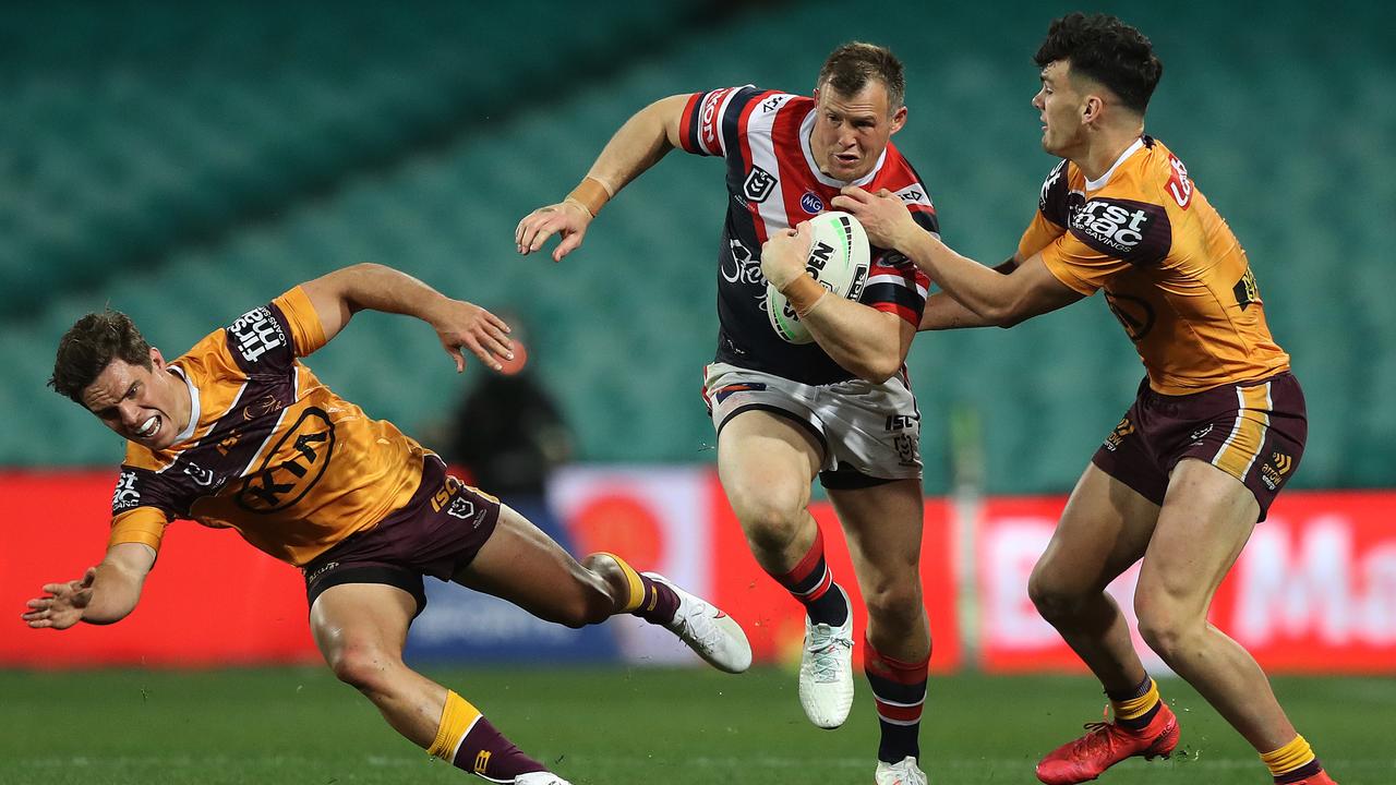 Roosters Josh Morris pushes Brodie Croft and Herbie Farnworth aside