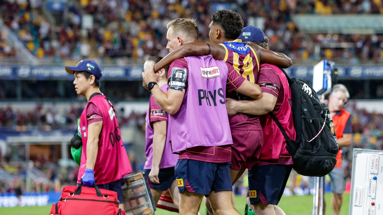 Keidean Coleman is helped off the ground after injuring his knee in Brisbane’s one-point loss to Carlton at the Gabba. Picture: Russell Freeman/AFL Photos via Getty Images
