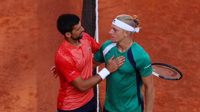 Novak Djokovic of Serbia shakes hands with Alejandro Davidovich Fokina of Spain. (Photo by Clive Brunskill/Getty Images)