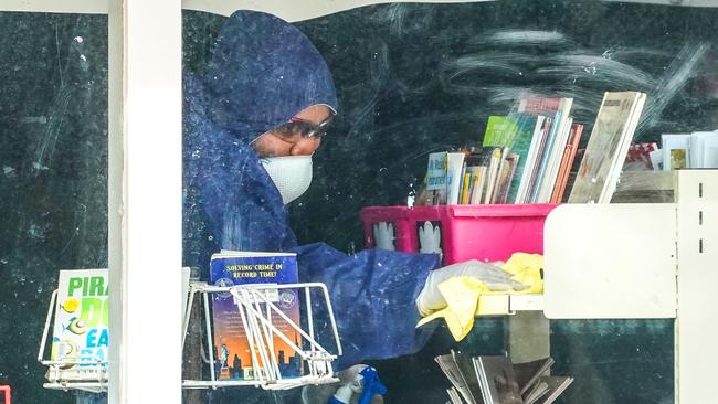 A cleaner at Meadowglen Primary School in Melbourne, where a music teacher has tested positive for the coronavirus. Picture: AAP