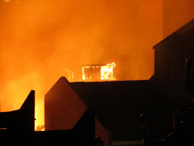 Firefighters work to put the inferno out near Melbourne's Nylex Grain Silo site. Picture: Kiah Doodie