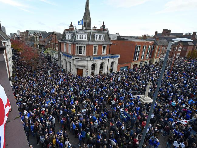 People gather in Jubilee Square to take part in what is being dubbed as the ‘Vichai March’ or the ‘5000-1’ march towards the King Power Stadium. Picture: AFP