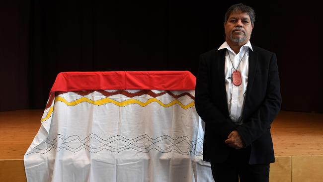 Gudju Gudju Fourmile of the Gimuy Walubara Yidinji people poses in front of the coffin with the remains of an Australian Aboriginal in the museum of the five continents in Munich in 2019. Picture: Christof STACHE / AFP