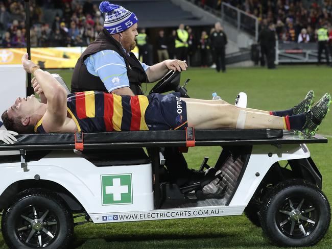 Josh Jenkins is carted from Adelaide Oval with a knee injury after the final siren taken from the oval with a knee injury Picture Sarah Reed