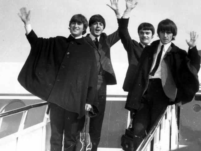 Beatles pop band arriving in Australia for tour. (L-R) John Lennon with Paul McCartney, Jimmy Nicol and George Harrison 1964. Picture: News Corp