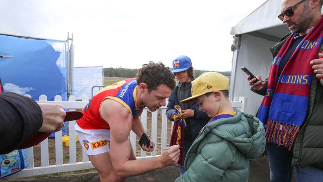 The start of the show, Neale, signing an autograph after the match. Picture: Brett Hartwig