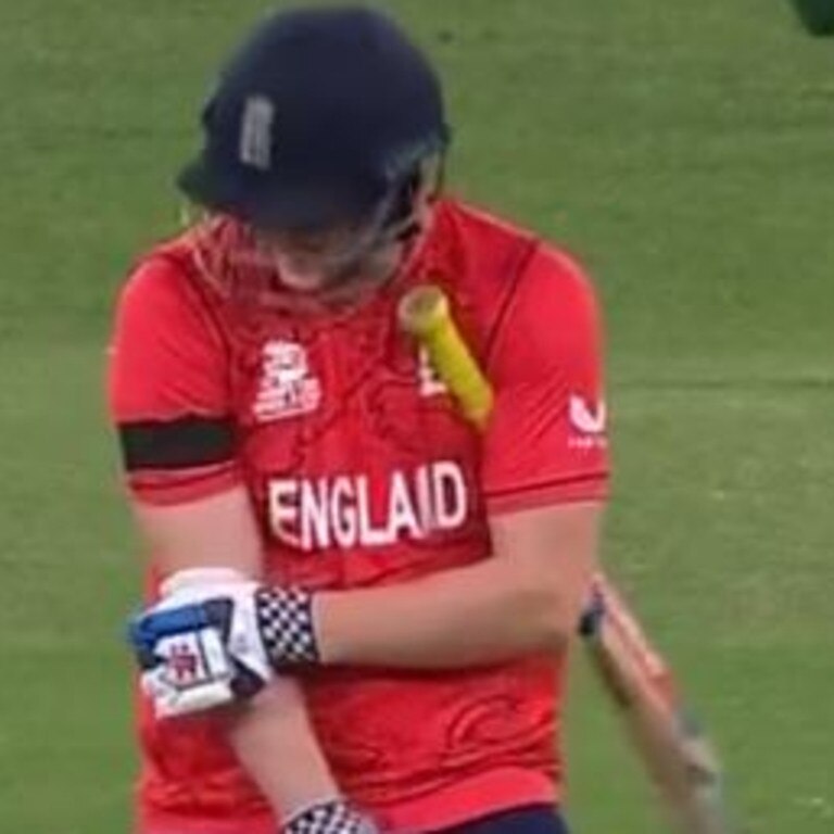 Harry Brook grabs at his elbow after being struck.