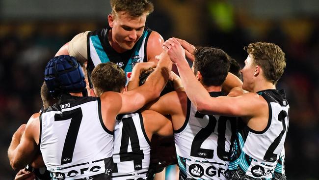 Port Adelaide players celebrate a goal against Geelong. Picture: Getty