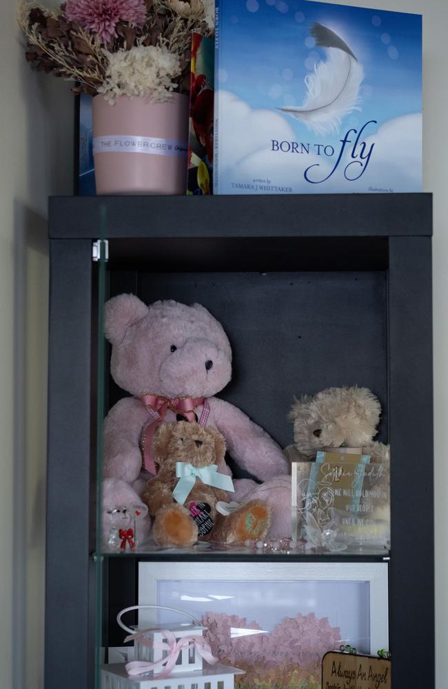 A memorial shelf, including a Pink teddy bear that contains her ashes, for baby Sophie at her Bahrs Scrub home in Logan, south of Brisbane. Picture: David Kelly