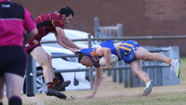 Thirlmere's Dylan Cooper drags Campbelltown City's Adam Rye into touch at Fullwood Reserve, reserve grade, Macarthur Rugby League, Round 15, 2023. Picture: Steve Montgomery