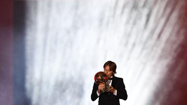 Modric kisses the trophy. Picture: AFP