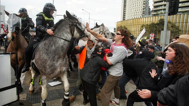 Protesters clash with police at the Melbourne rally on September 11. Picture: Luis Enrique Ascui