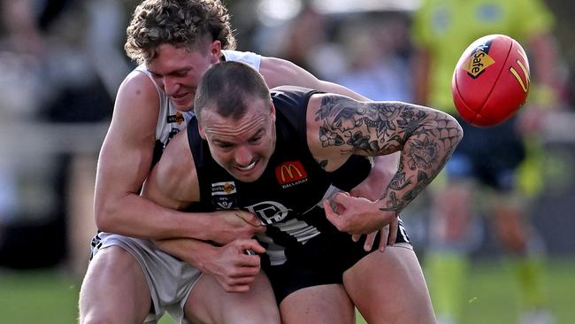 BFL: Melton South’s Cody Chapman wraps up Bailey Young of Darley. Picture: Andy Brownbill