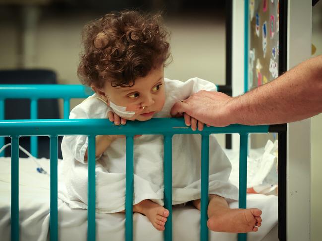 Dad Matt Busuttil held his son’s hand in pre-op. Picture: David Caird