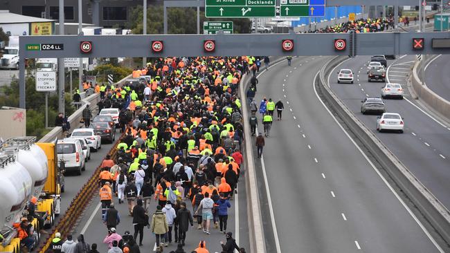 On the West Gate Bridge, protesters threw objects at passing cars, including rocks and bottles, and hurled abuse when people tried to move. Picture: AFP