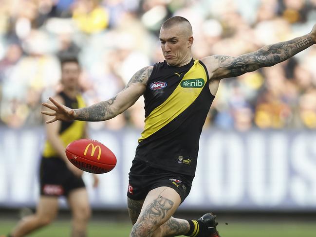 MELBOURNE, AUSTRALIA - AUGUST 19: Dustin Martin of the Tigers kicks the ball during the round 23 AFL match between Richmond Tigers and North Melbourne Kangaroos at Melbourne Cricket Ground, on August 19, 2023, in Melbourne, Australia. (Photo by Daniel Pockett/Getty Images)