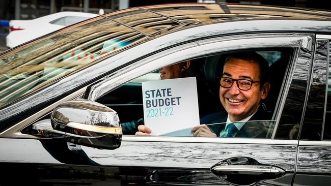 A smiling Premier Steven Marshall with the 2021-22 budget papers. Picture: Mike Burton