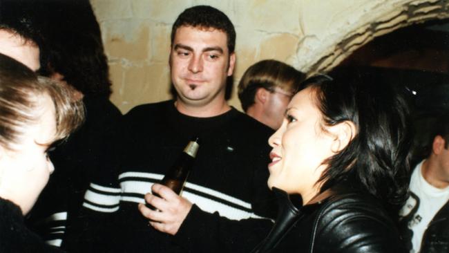 Advertiser journalist Patrick McDonald keeps a watchful eye on singer Kate Ceberano, right, squashed between the archways and bar at Tapas for a CD launch in the 1990s.