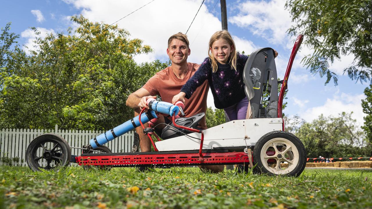 Alastair Buchan gets daughter Vivien Buchan ready to race in the Greenmount Billy Kart Challenge, Saturday, November 23, 2024. Picture: Kevin Farmer