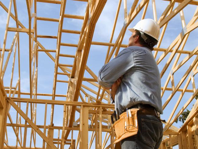 generic pic of builder inside new house under construction